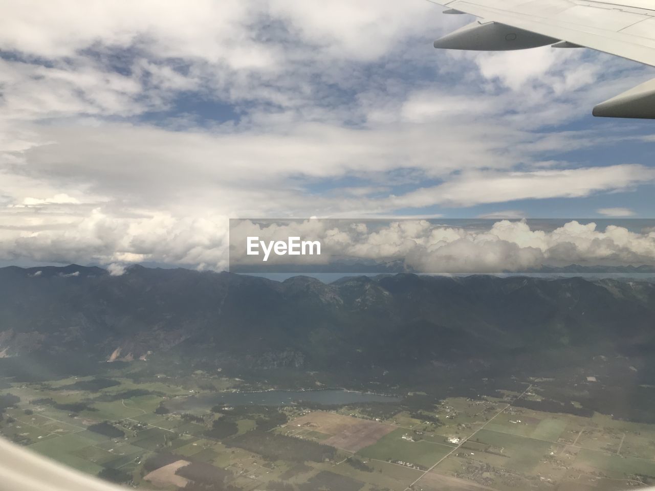 cloud - sky, airplane, air vehicle, sky, flying, aerial view, transportation, mode of transportation, scenics - nature, beauty in nature, aircraft wing, no people, mid-air, travel, nature, environment, day, landscape, outdoors, vehicle interior