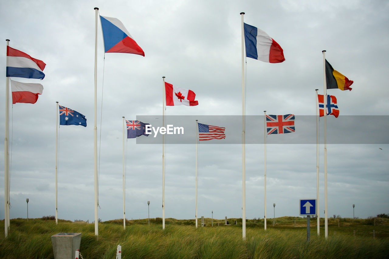 LOW ANGLE VIEW OF FLAGS FLAG ON FIELD