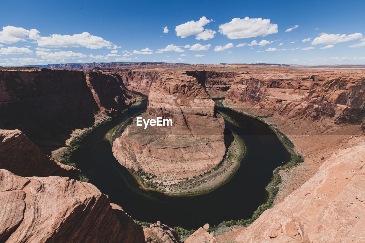 Aerial view of colorado river flowing amidst canyon