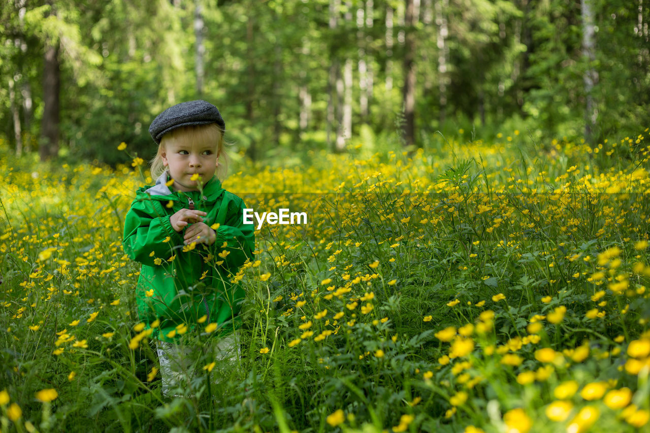 Boy standing on field