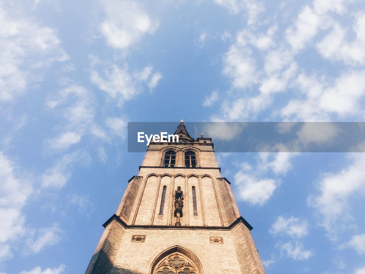 Low angle view of bell tower against sky