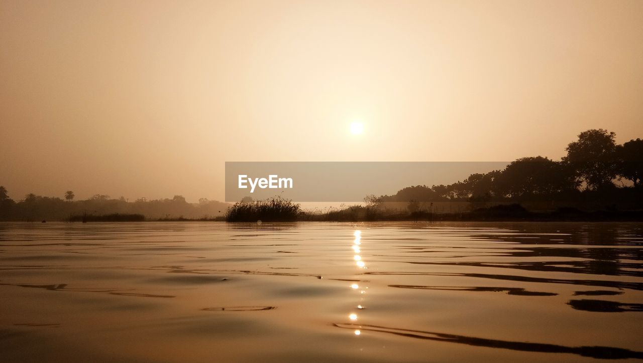 LAKE AGAINST SKY DURING SUNSET