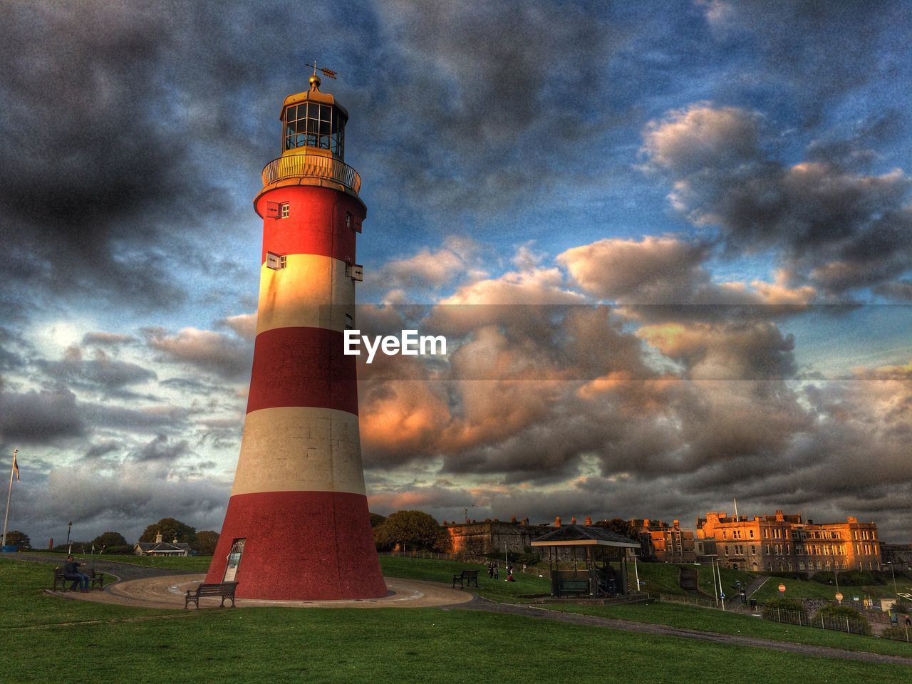 LIGHTHOUSE ON LIGHTHOUSE AGAINST CLOUDY SKY