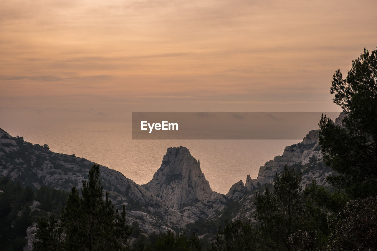 Scenic view of mountains against sky during sunset