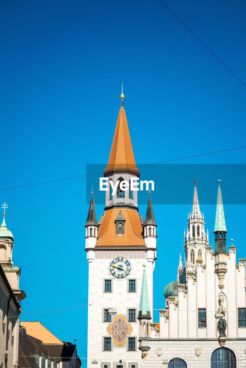 Low angle view of church against blue sky