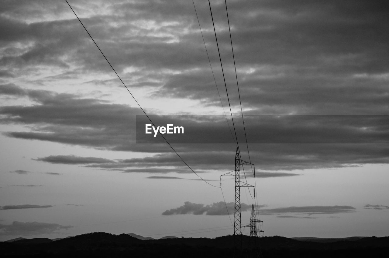 LOW ANGLE VIEW OF ELECTRICITY PYLONS