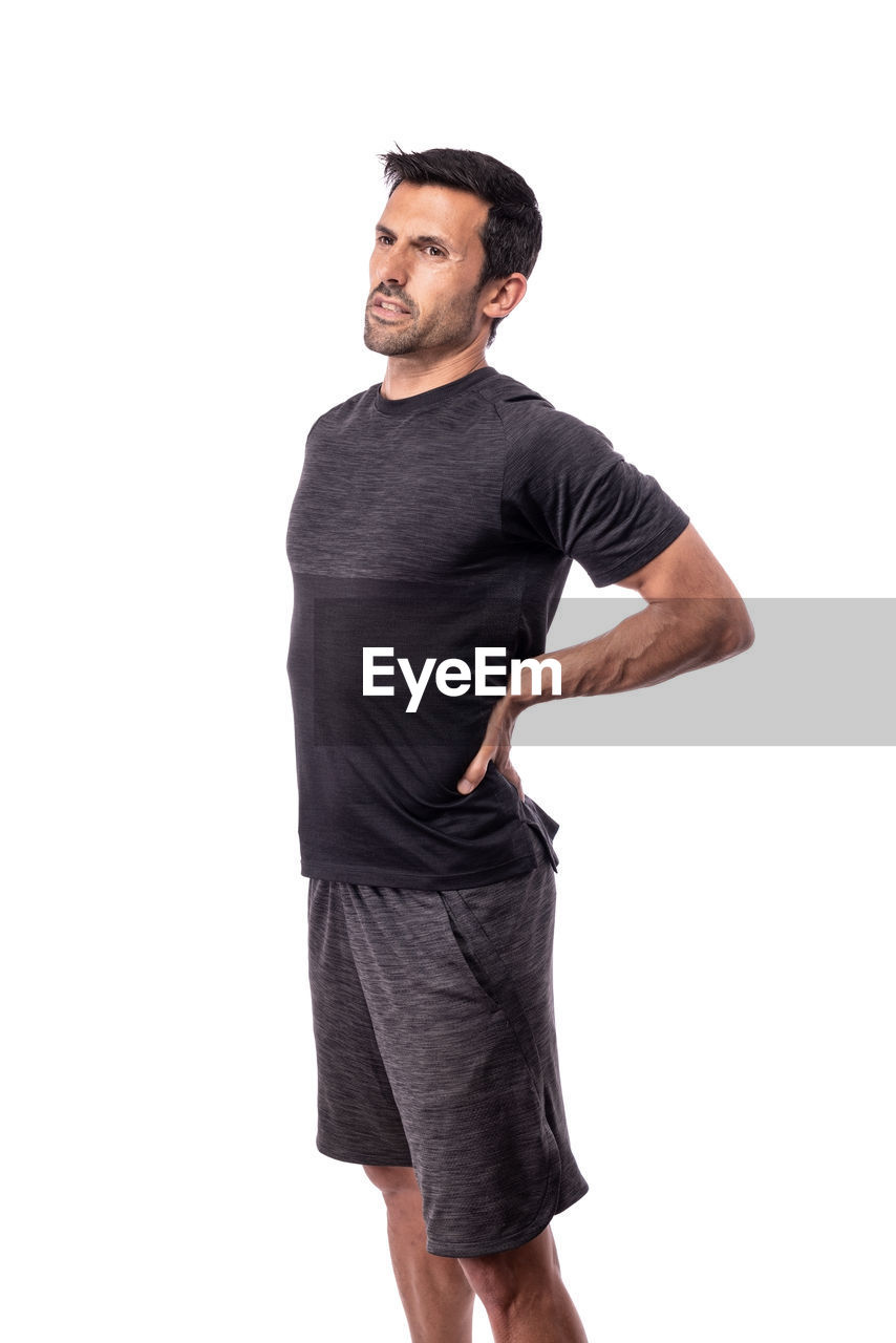 YOUNG MAN LOOKING AWAY OVER WHITE BACKGROUND