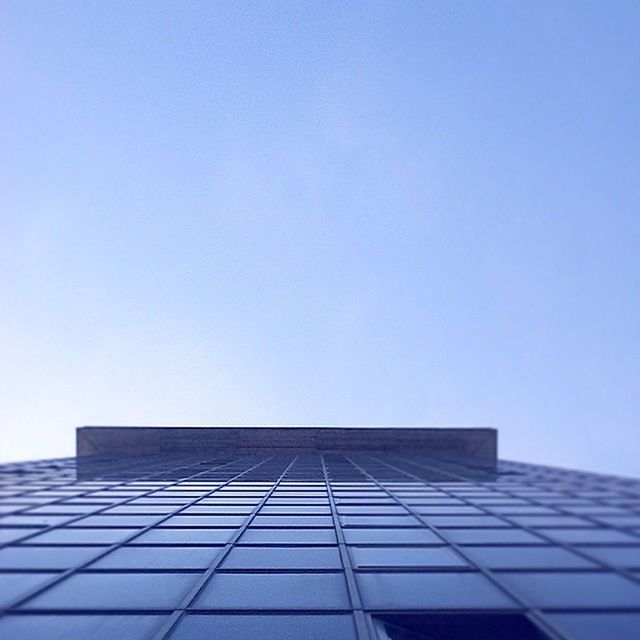 LOW ANGLE VIEW OF MODERN BUILDINGS AGAINST CLEAR SKY