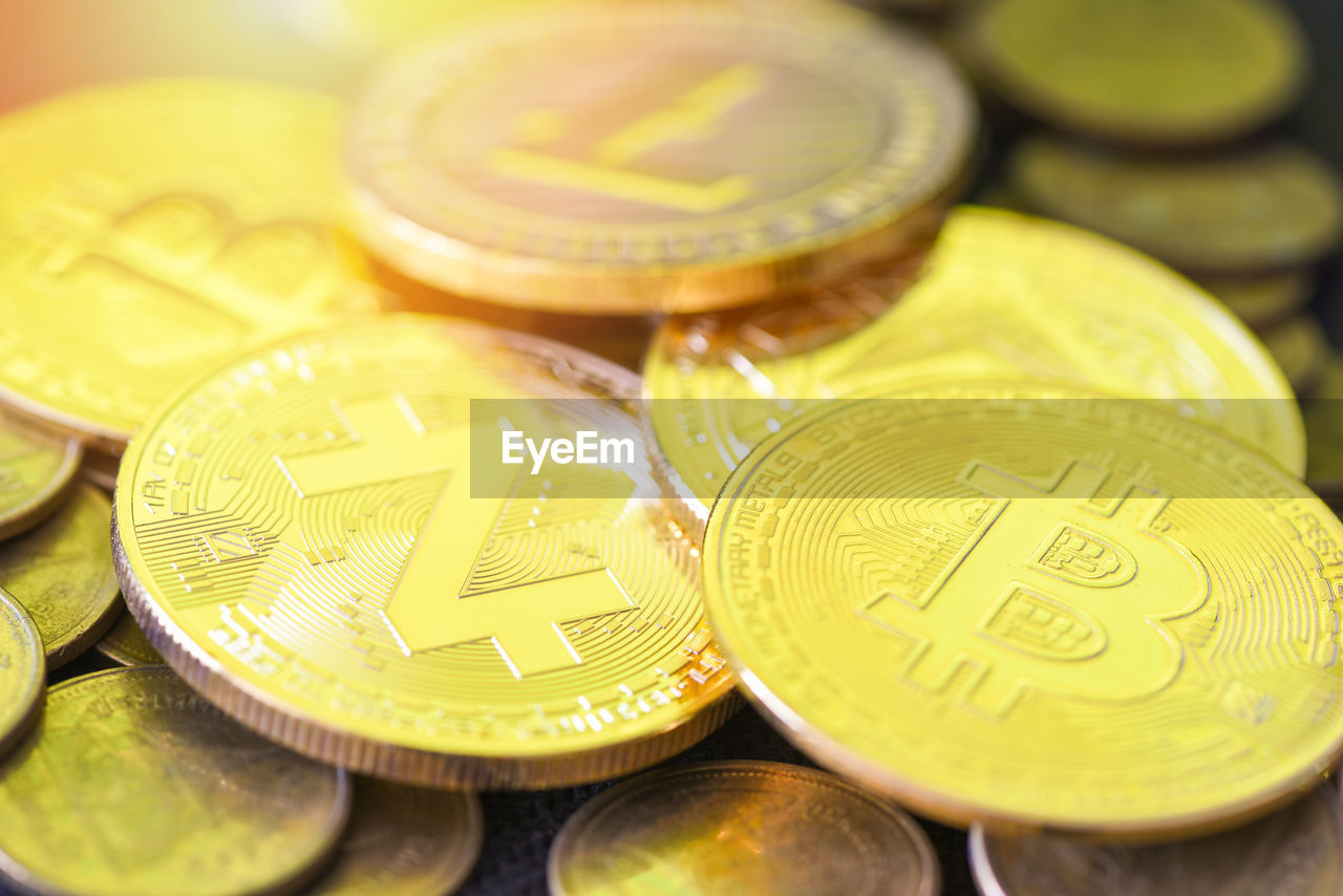 HIGH ANGLE VIEW OF COINS ON METAL