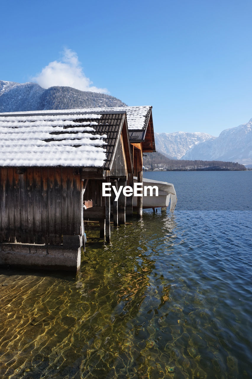 SCENIC VIEW OF LAKE AGAINST MOUNTAIN RANGE