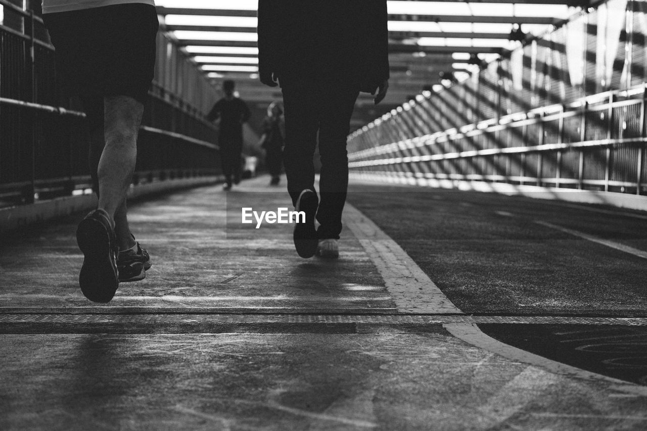 Low section of people on footbridge