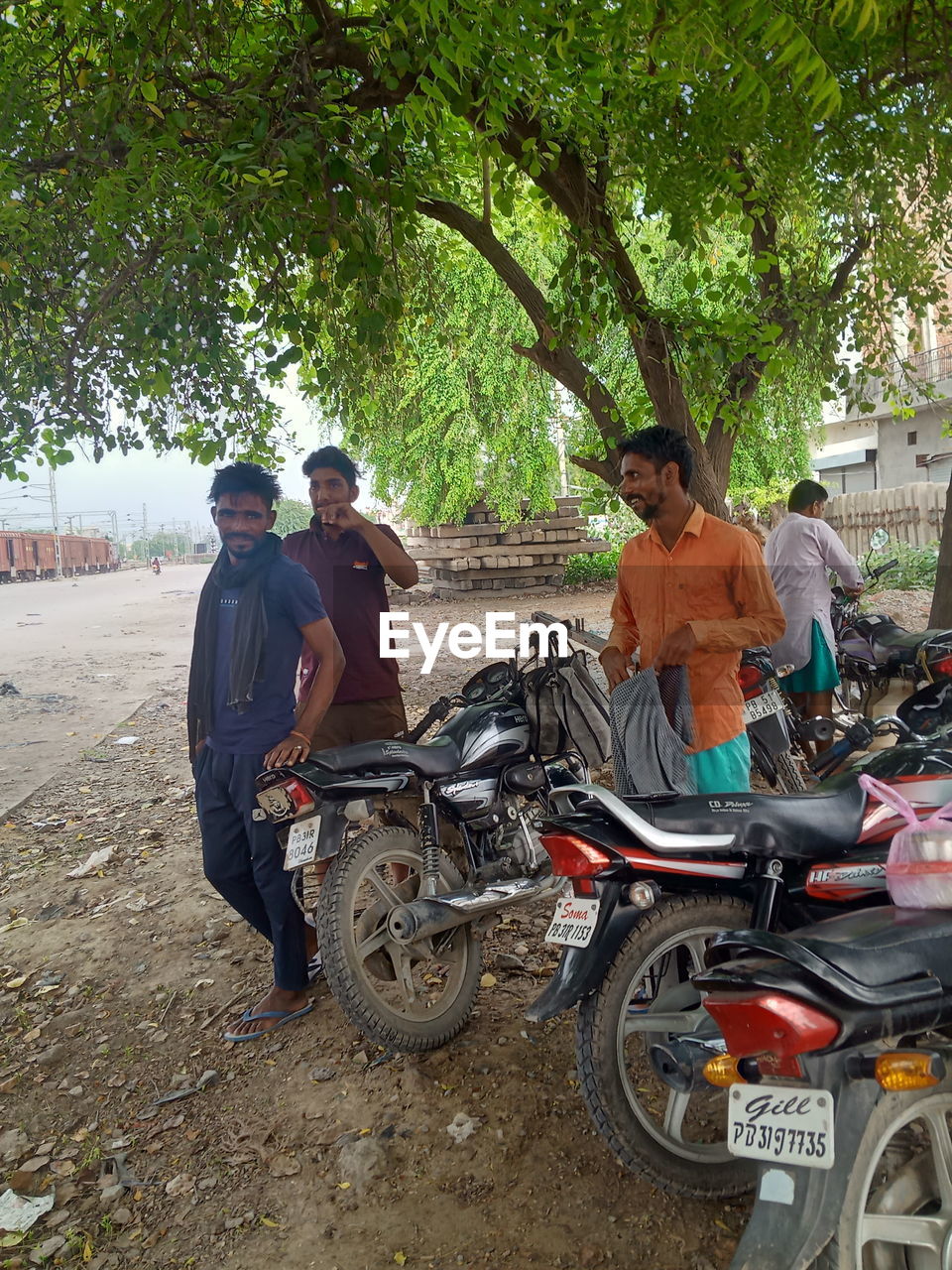 PEOPLE RIDING MOTORCYCLE ON STREET