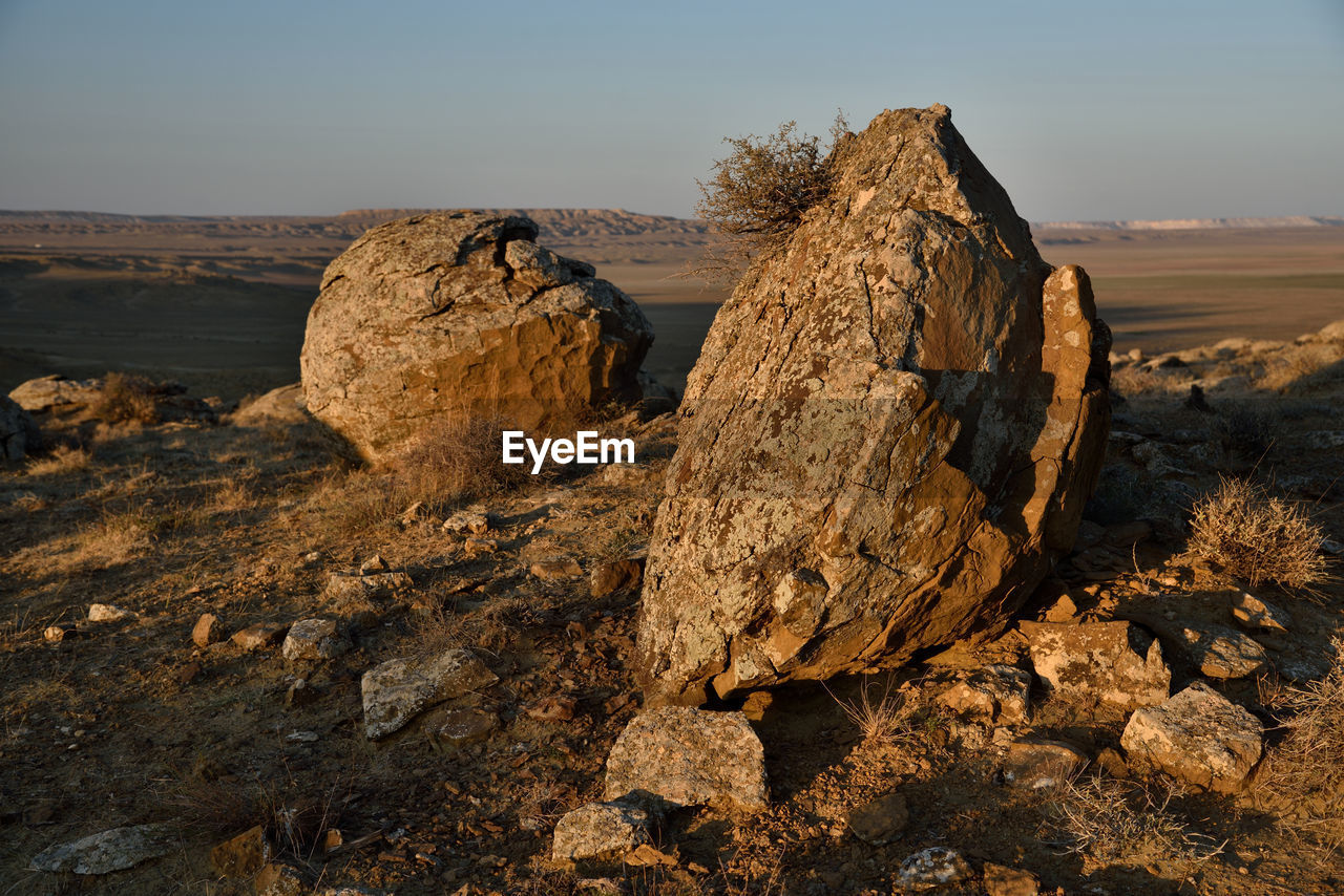 Rock formation on land against sky