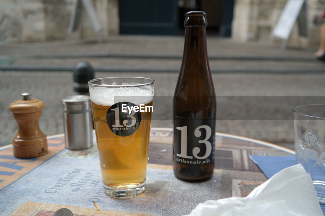 text, still life, drink, table, refreshment, food and drink, no people, communication, focus on foreground, close-up, drinking glass, indoors, day, freshness