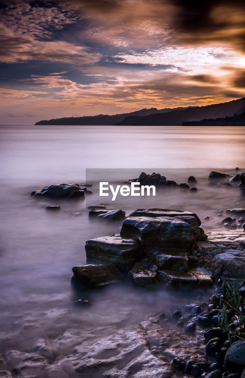 Scenic view of sea against sky during sunset