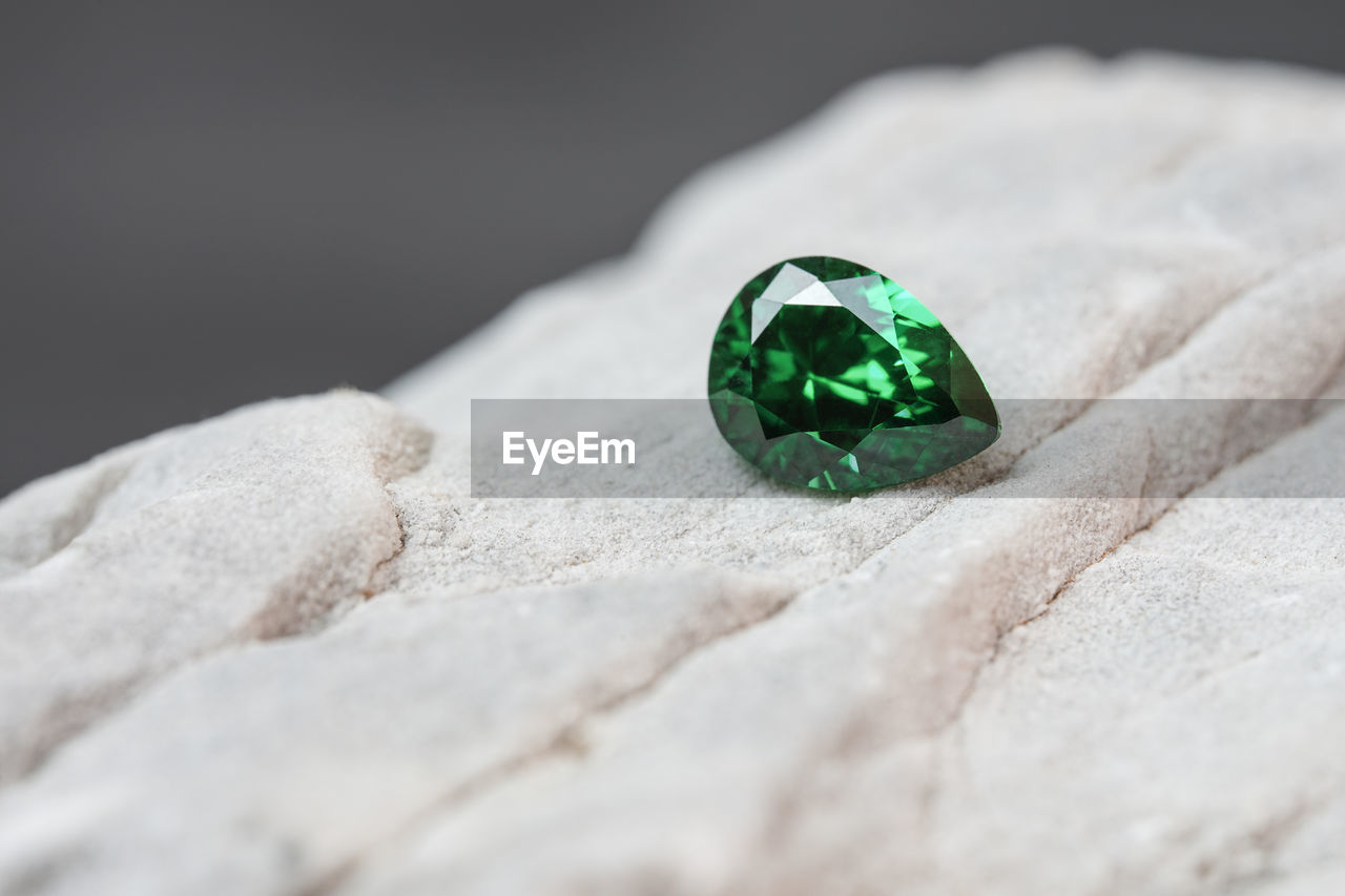 jewellery, green, fashion accessory, gemstone, close-up, emerald, macro photography, no people, nature, selective focus, environment, environmental conservation, studio shot, jewelry, indoors, rock