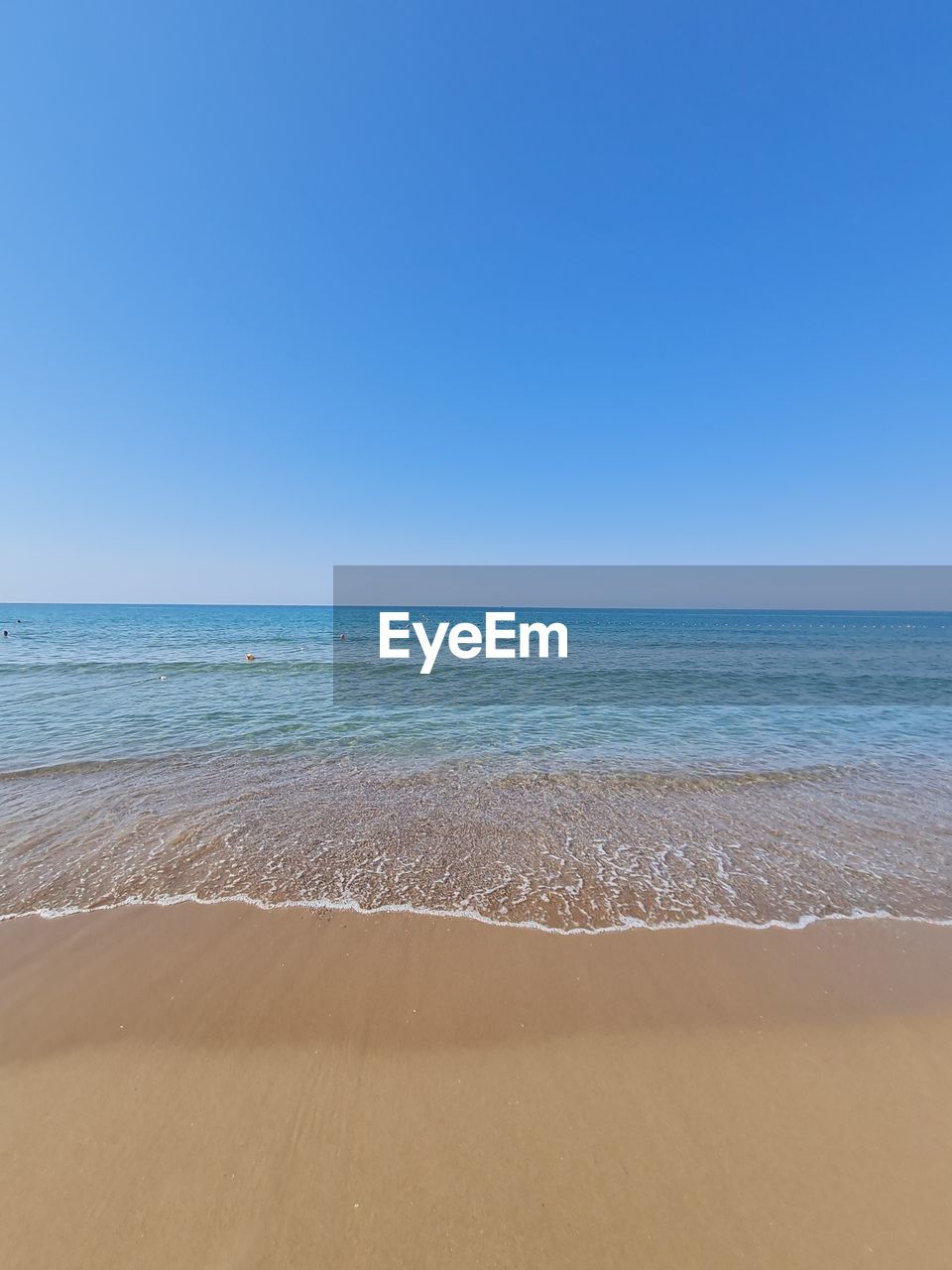 SCENIC VIEW OF BEACH AGAINST CLEAR SKY