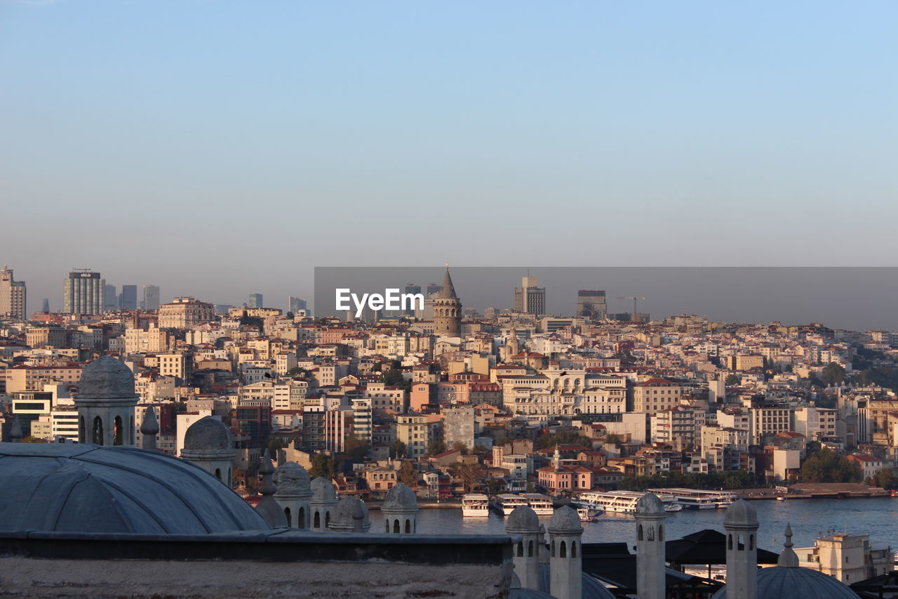 Aerial view of buildings in city against clear sky in istanbul and galata