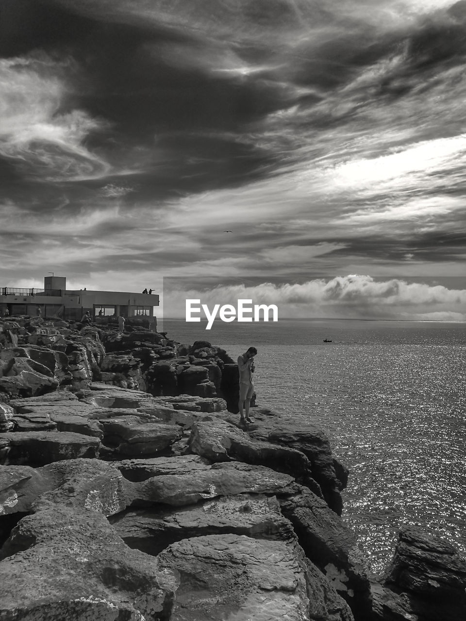 SEA AGAINST CLOUDY SKY