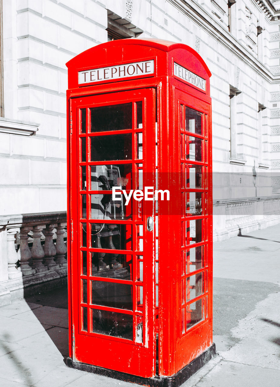 RED TELEPHONE BOOTH ON SNOW