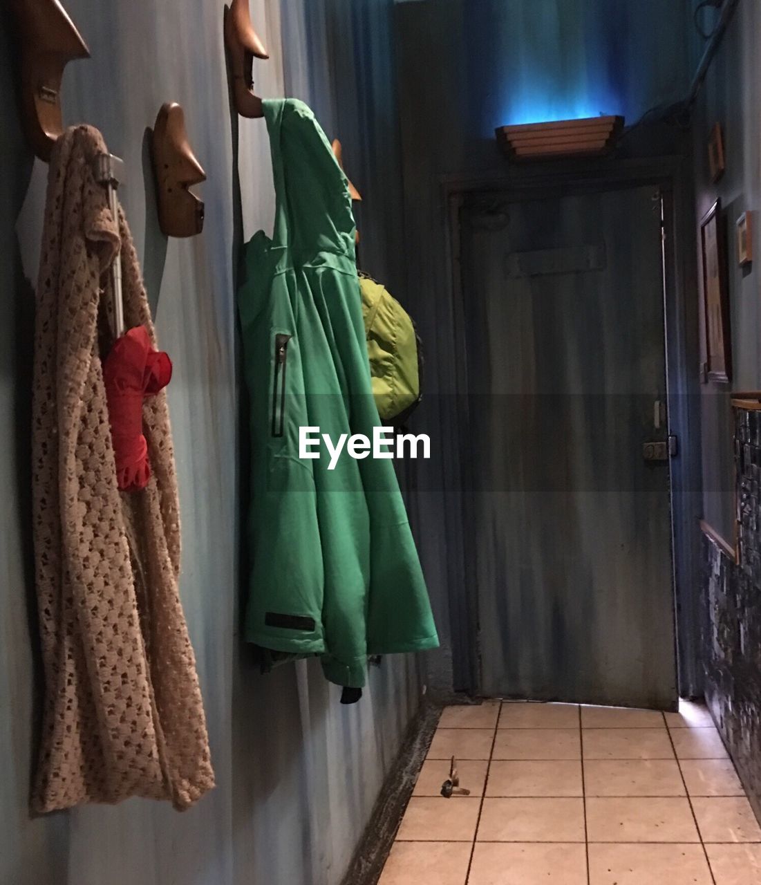 Clothes hanging on hook in room