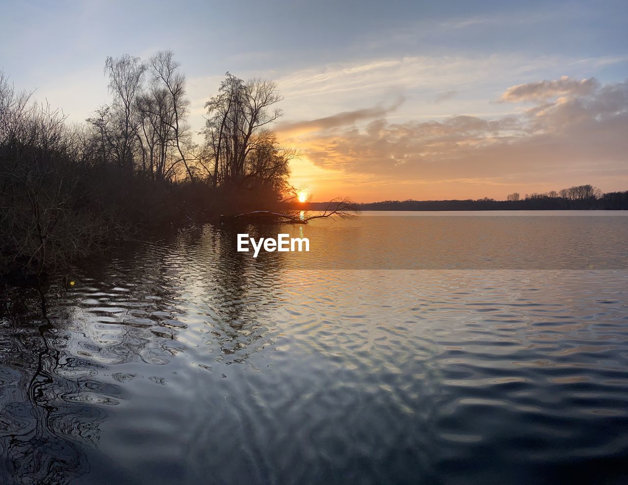 SCENIC VIEW OF LAKE DURING SUNSET