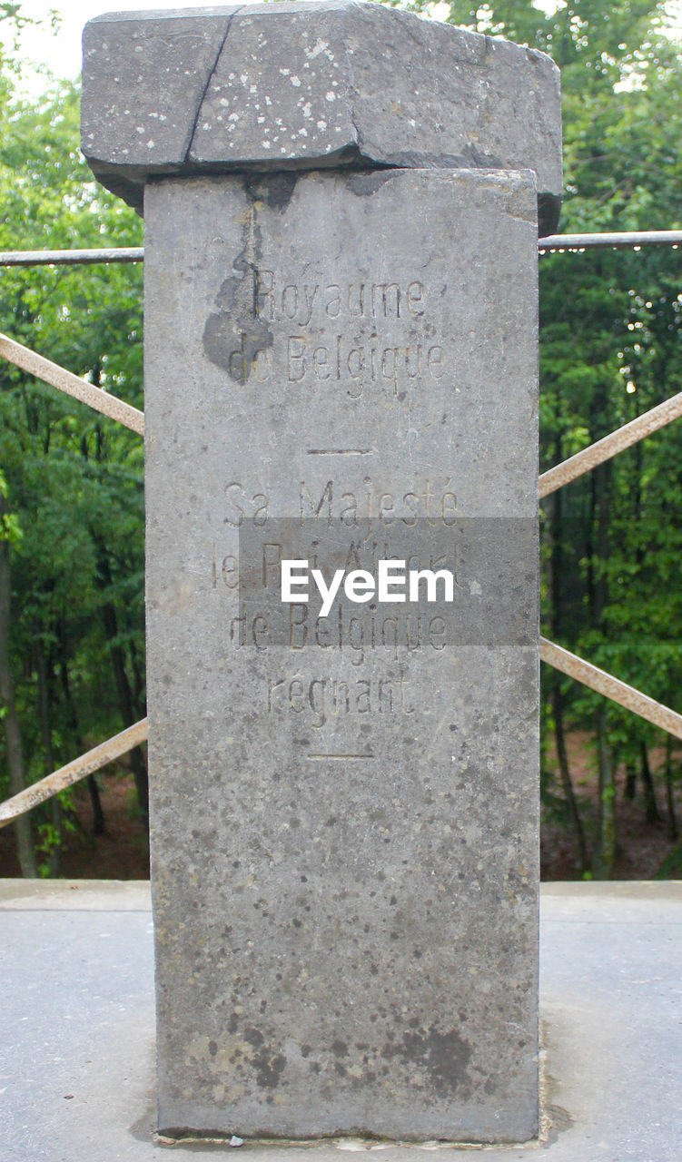 TEXT ON STONE WALL