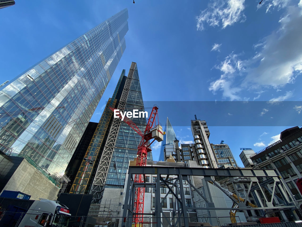 Low angle view of modern buildings against sky in city of london