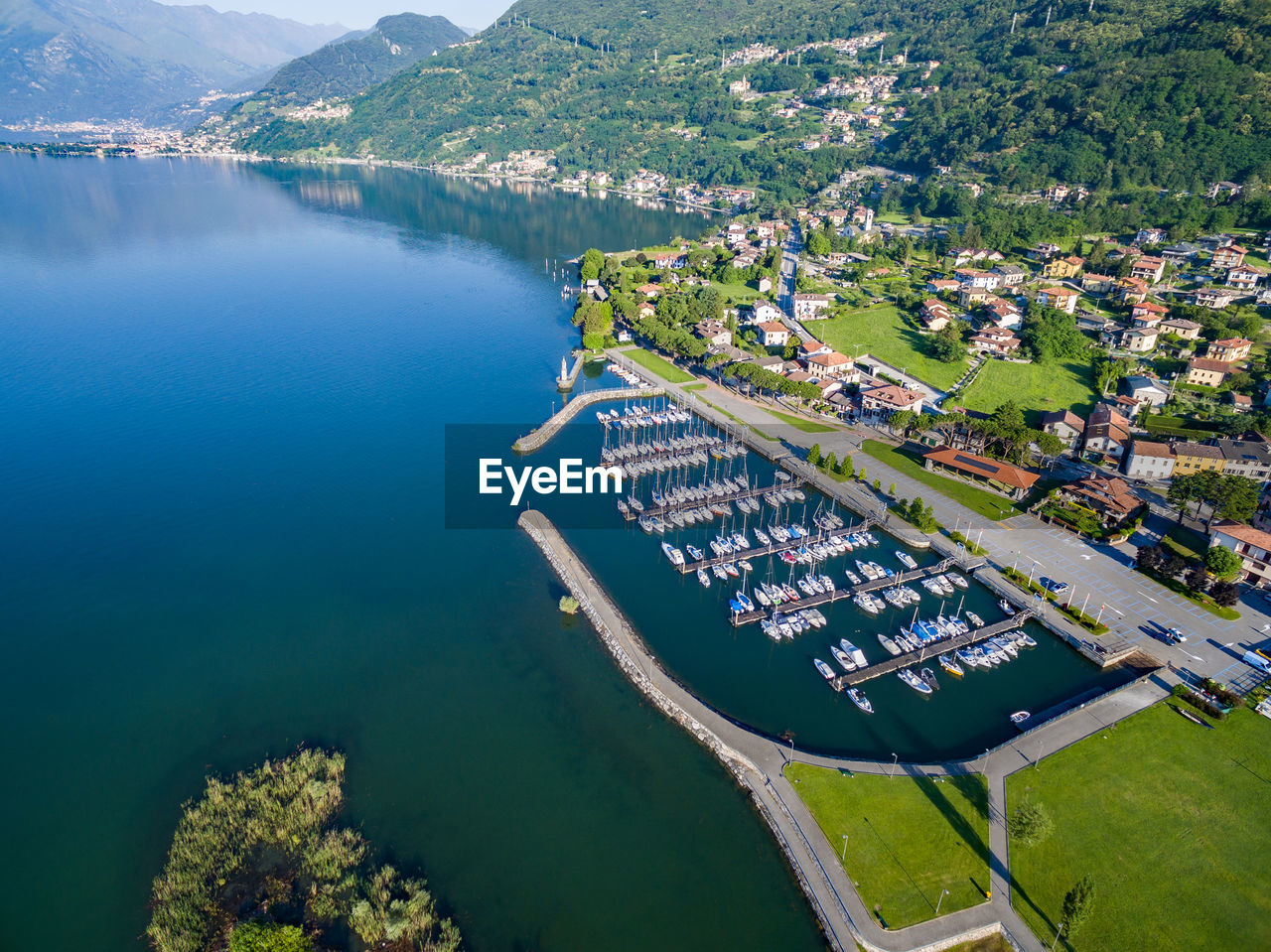 HIGH ANGLE VIEW OF LAKE AND BUILDINGS