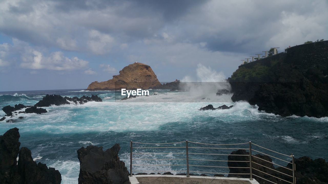 WAVES SPLASHING ON ROCKS