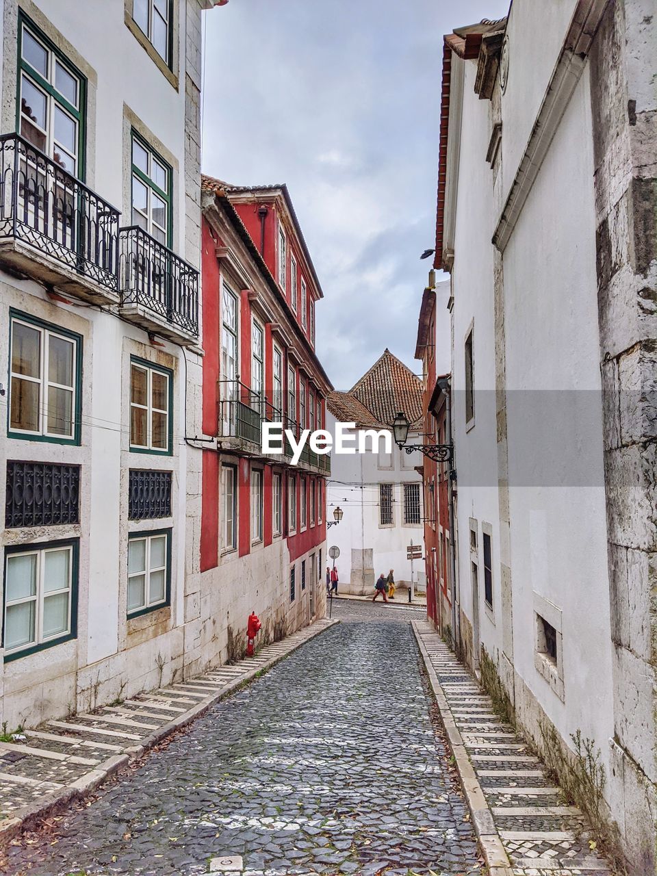 Narrow alley amidst buildings in old town