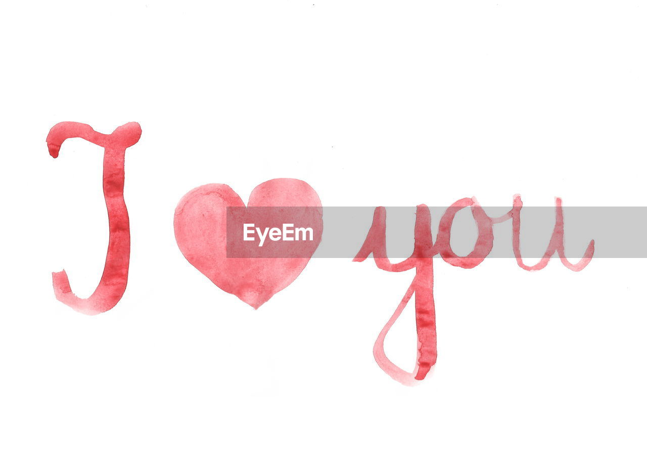 Close-up of i love you text over white background