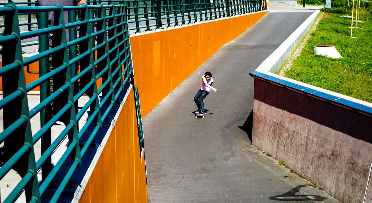 Man skateboarding on street