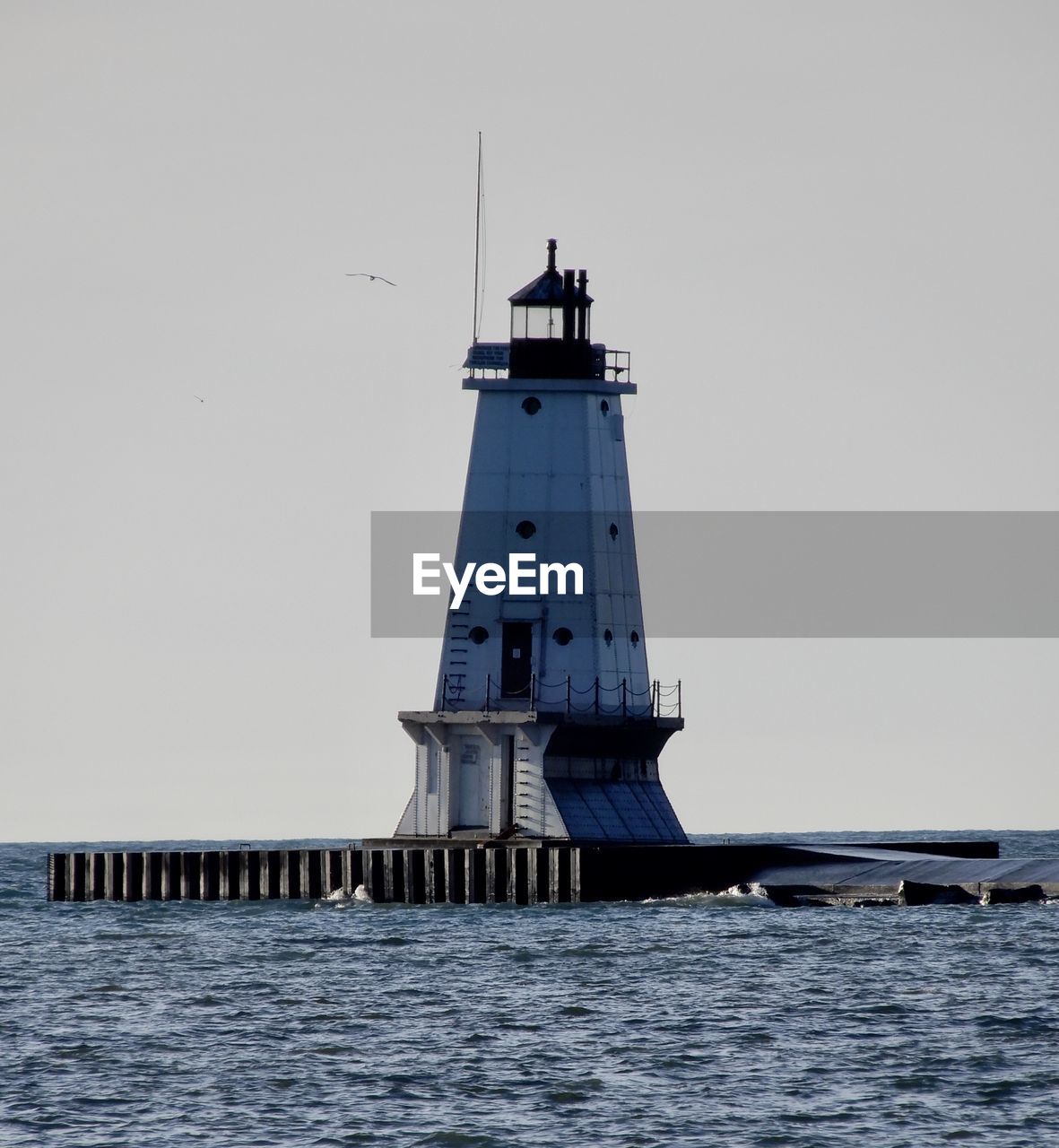 The ludington lighthouse stands majestically on lake michigan 