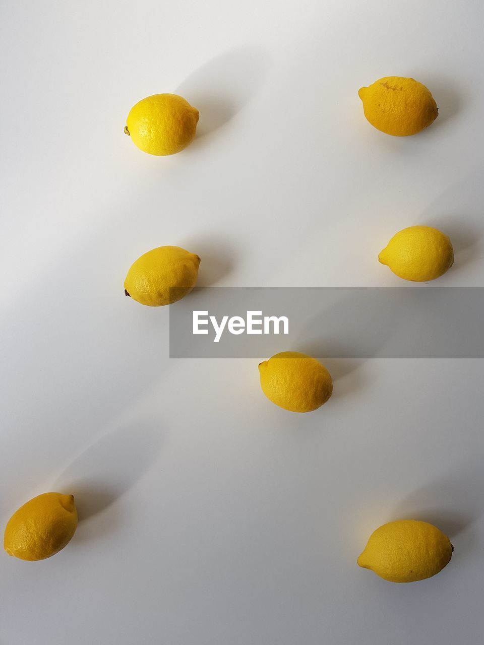 Close-up of lemons on white background
