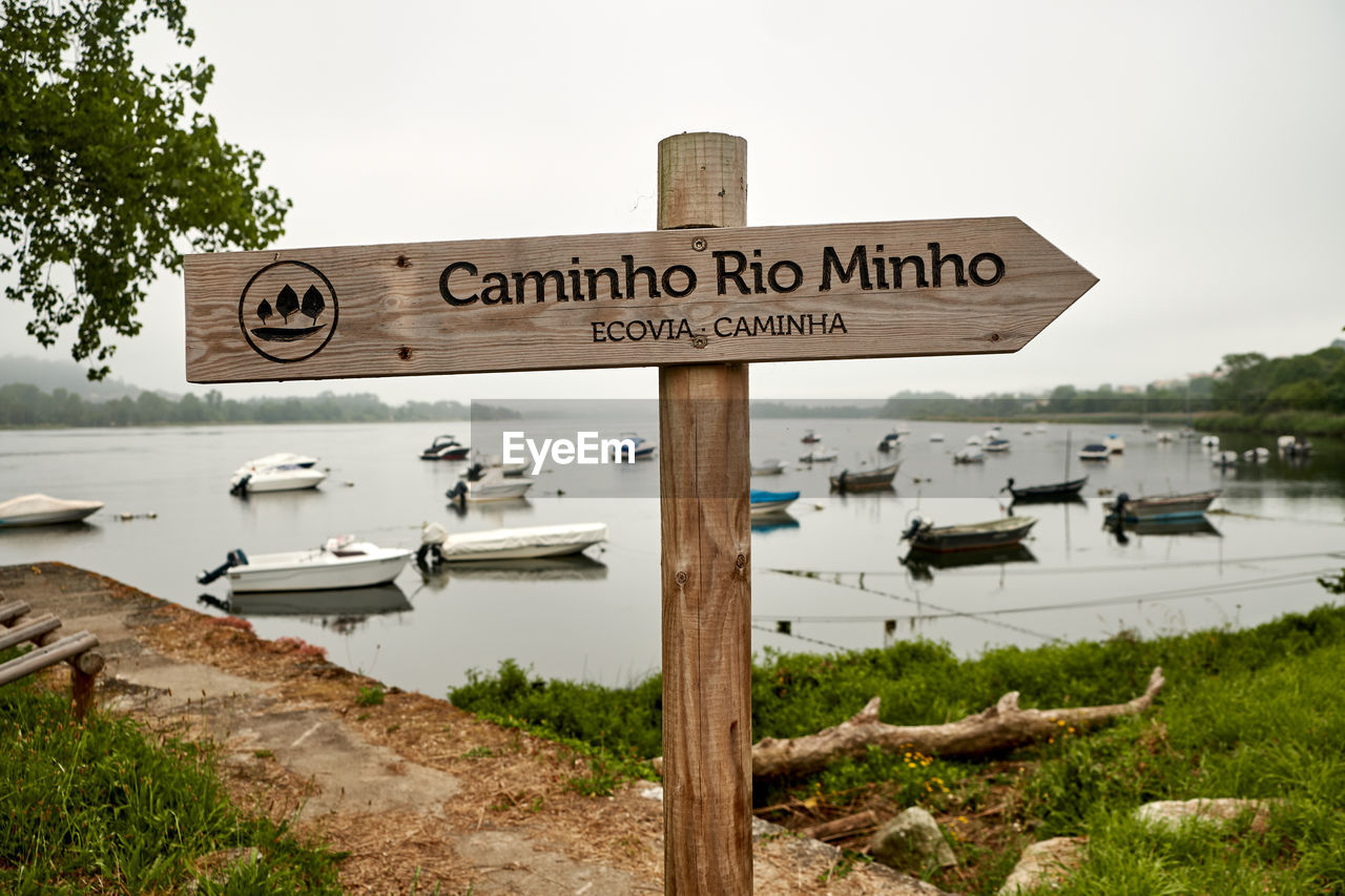 Close-up of signboard against sky