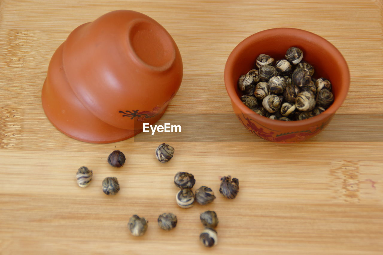 High angle view of jasmin green tea in bowl on table