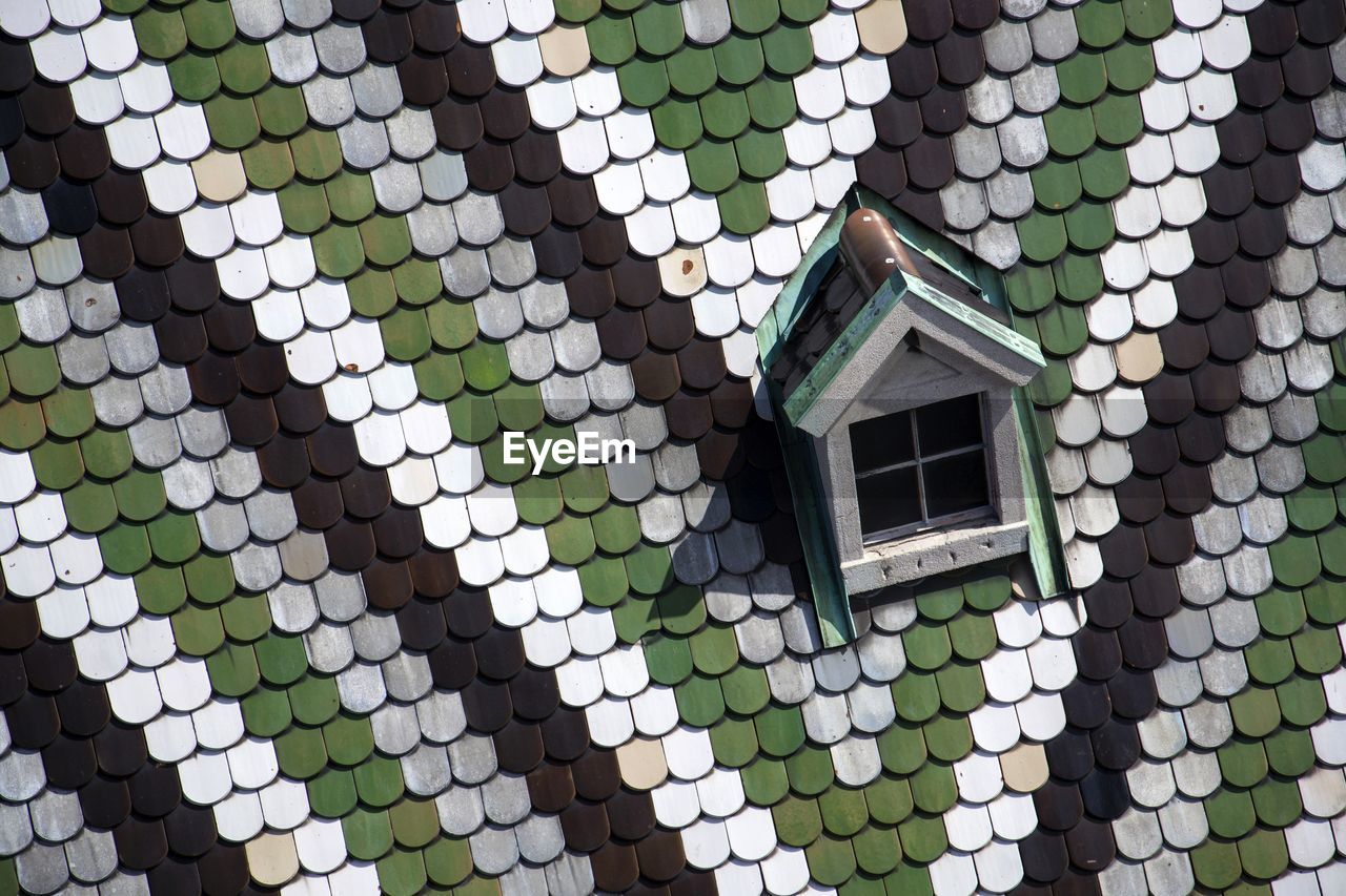 green, architecture, built structure, pattern, no people, building exterior, flooring, building, day, full frame, wall, art, circle, outdoors, shape, backgrounds, road surface, high angle view, window