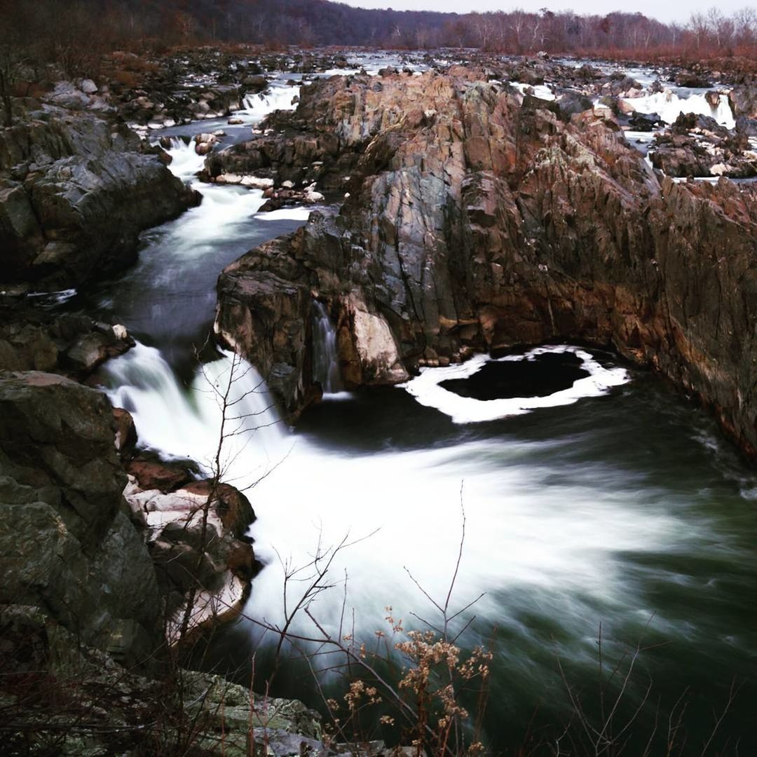 SCENIC VIEW OF WATERFALL IN SNOW