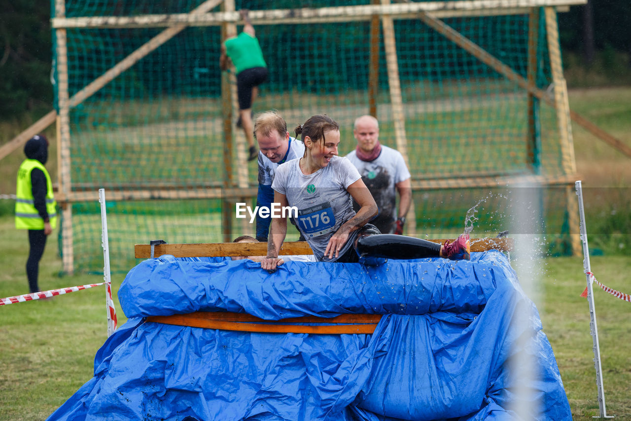 MAN PLAYING SOCCER ON FIELD