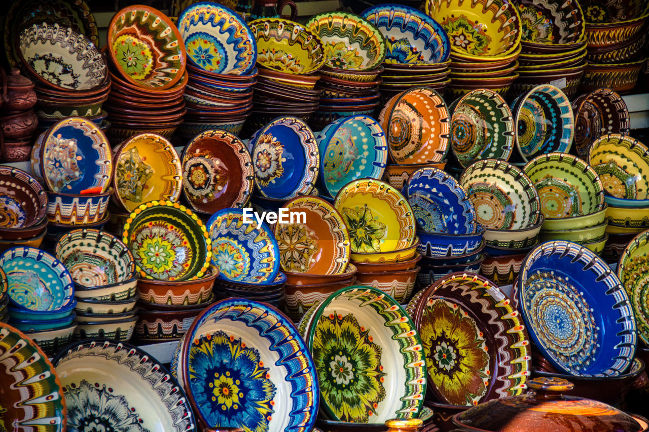 Full frame shot of colorful bowls for sale at market stall