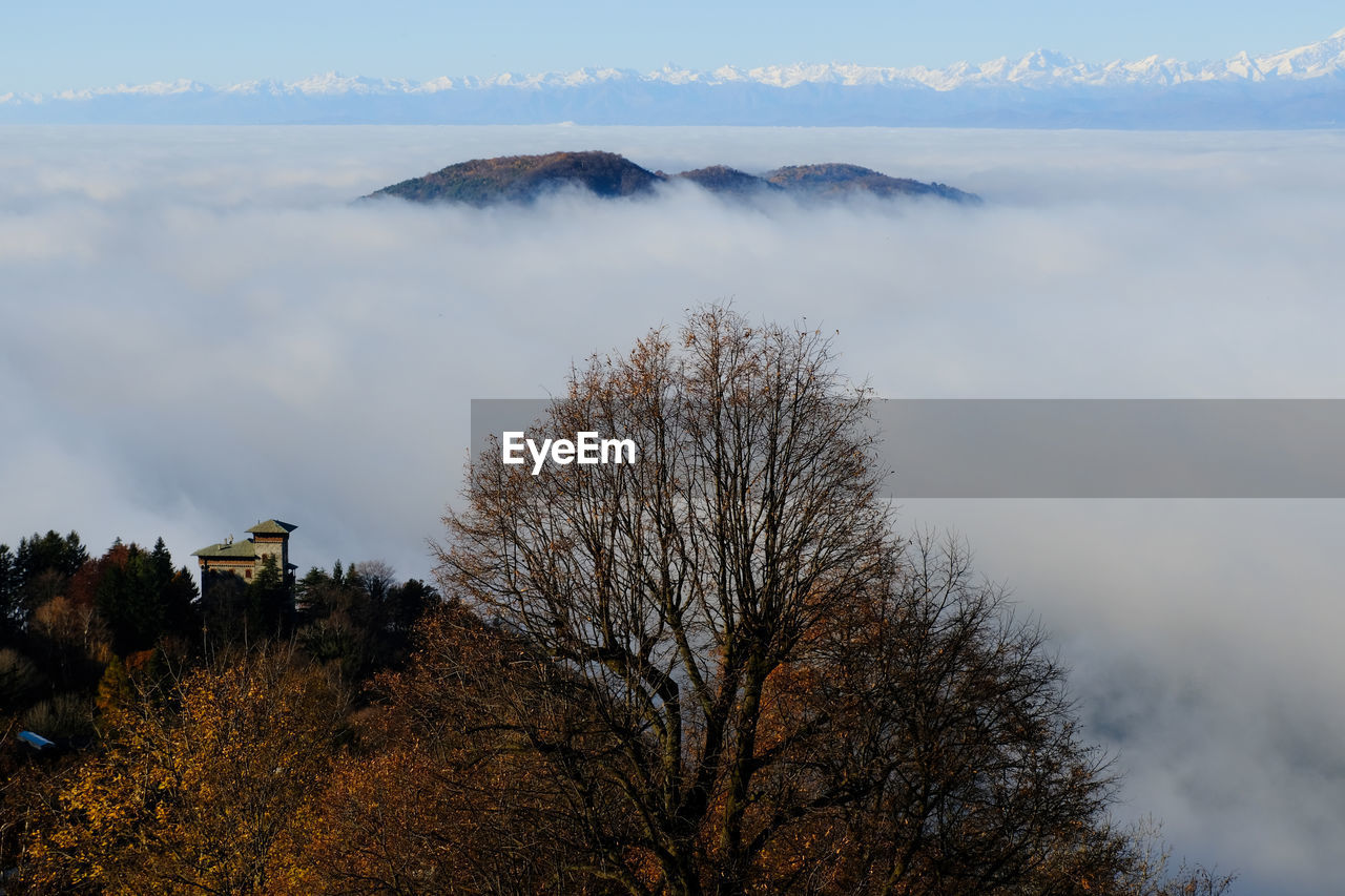 A sea of fog over the city of como and lake como, from a panoramic viewpoint in brunate.