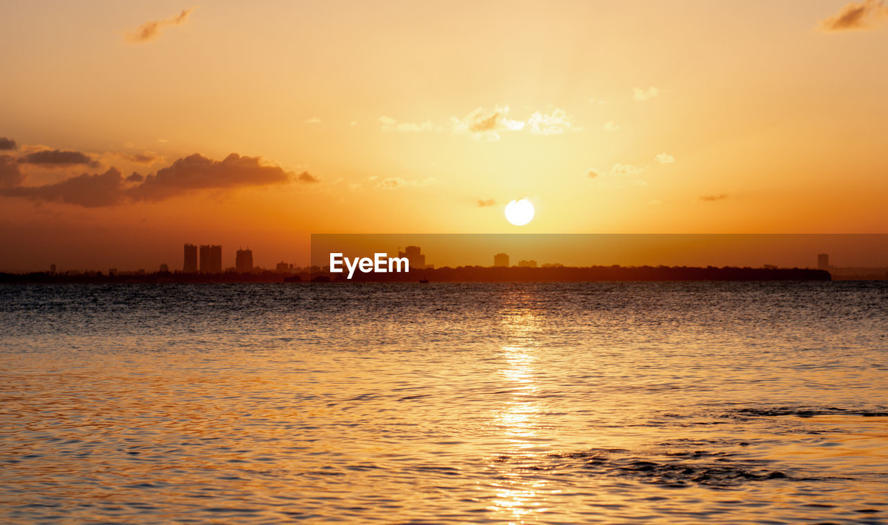 Scenic view of sunset over dar es salaam's cityscape
