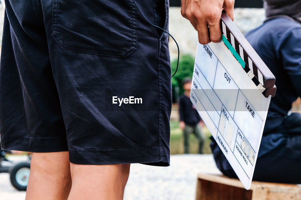 Film slate, close up image of film production crew holding film slate on set