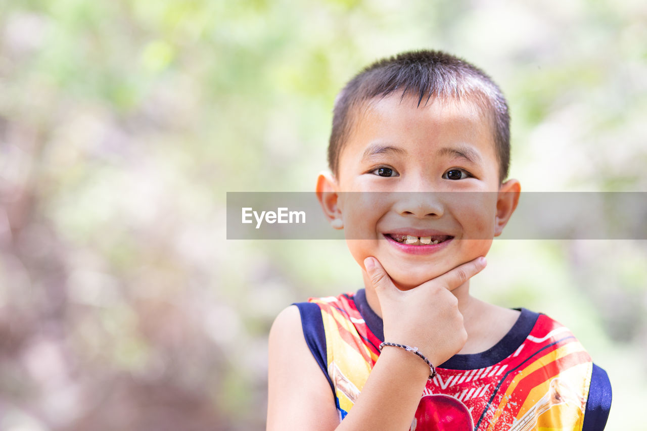 Close-up portrait of cute smiling boy