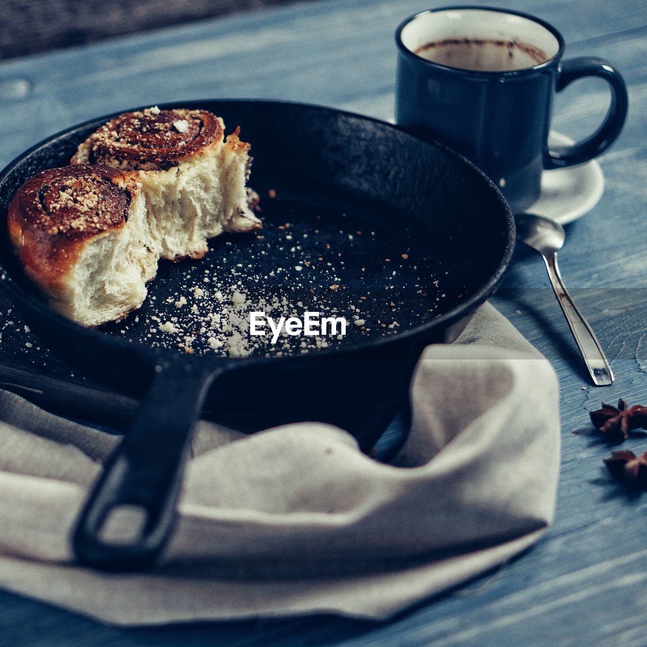 High angle view of leftover tart in pan by coffee cup on table