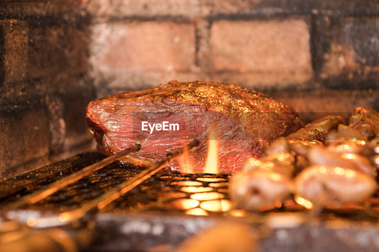 Close-up of meat on barbecue grill