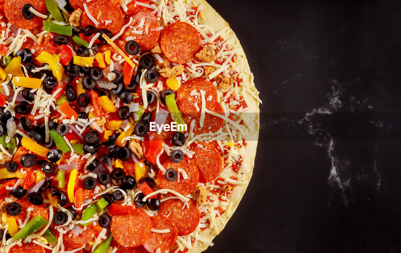 High angle view of pizza against black background