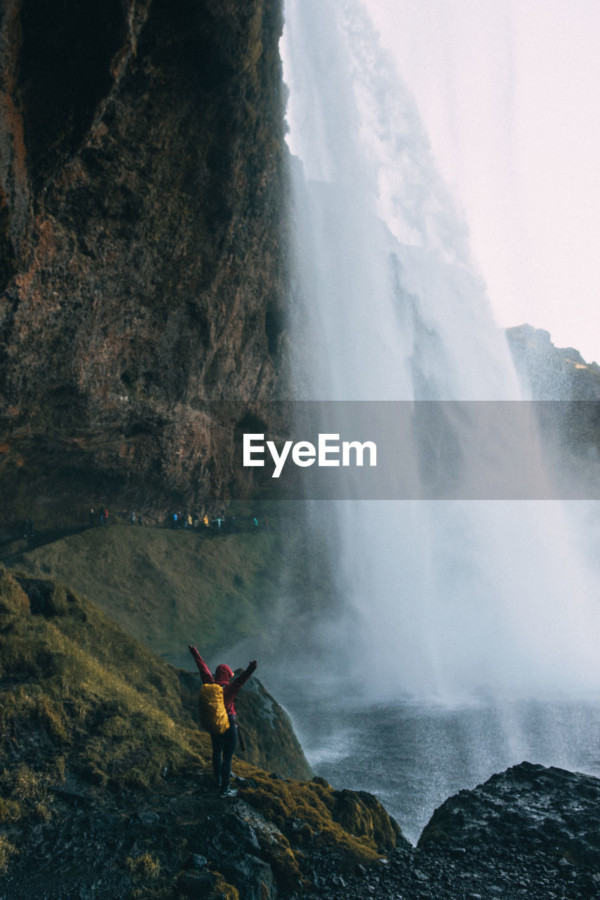 SCENIC VIEW OF WATERFALL AT ROCKS