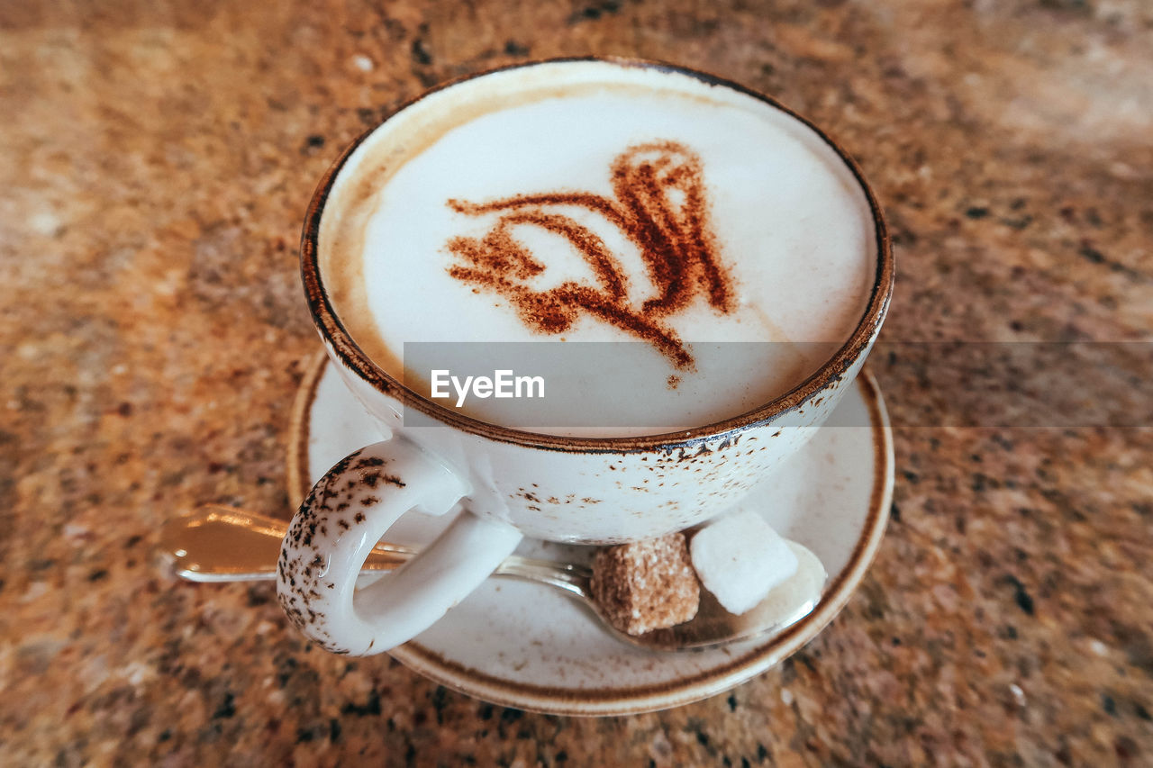 High angle view of cappuccino on table